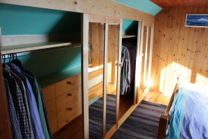 pine wardrobe with internal drawers fitted in coombed ceiling