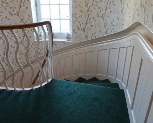 handrail integrated into curved wall panelling